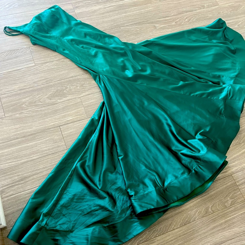 Stunning designer prom dress worn once. Slit to mid-thigh, fully lined.